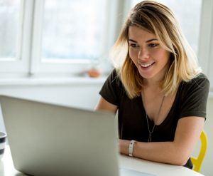 An image of a woman at her computer. This image represents a session of Online Therapy in Virginia. Work with an online therapist from the comfort of home in Powhatan, VA. | 23103 | 23005 | 23113 