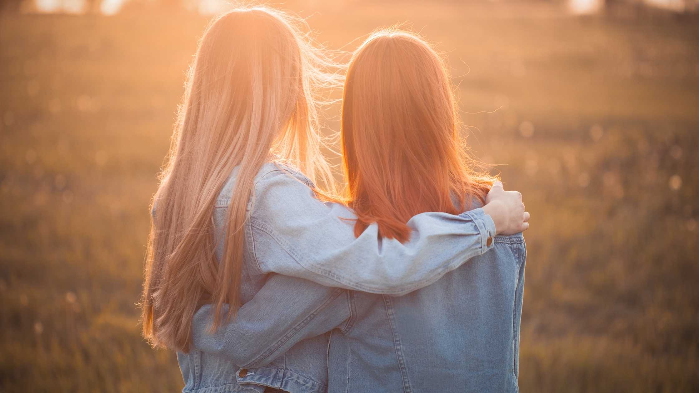 Friends in the sunset embracing. Online therapy in Virginia can help you heal. Get support with an online therapist for anxiety, stress, depression, trauma and more.