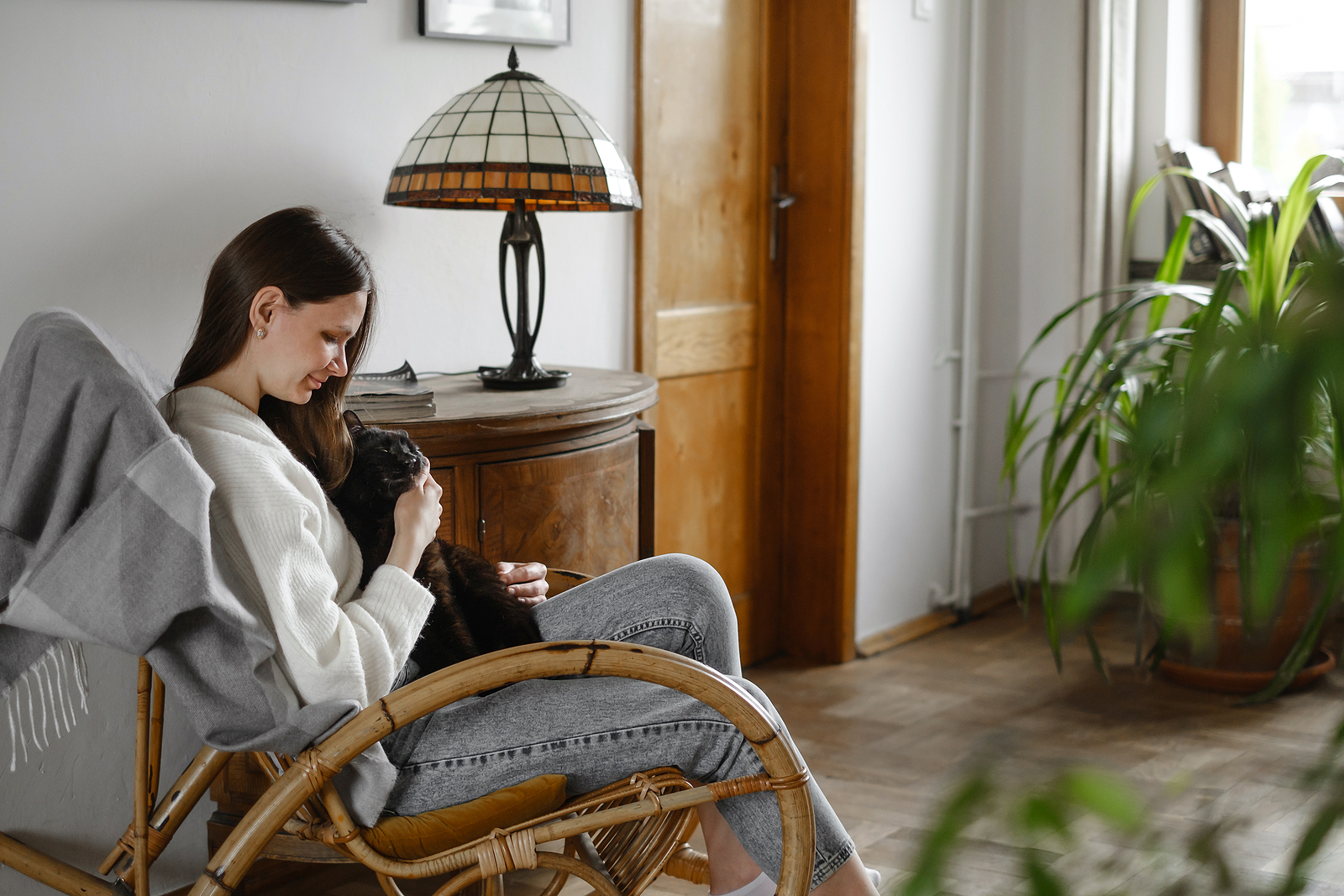 Young woman sitting contentedly in a chair with a black cat on her lap. Sometimes we need a bit of extra help to push past traumatic experiences. You can get that needed support through EMDR intensives in Virginia. Learn more here.