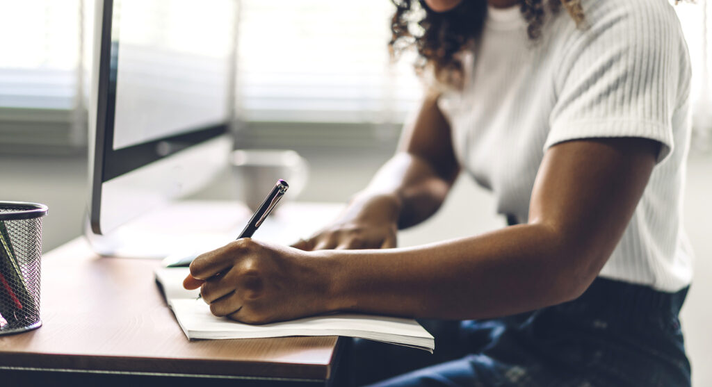 A close up of a person writing in a journal. This can represent a coping technique for addressing change. learn how an anxiety therapist in Richmond, VA can offer support with therapy for life transitions therapy in Virginia and other services like equine therapy in Virginia. 