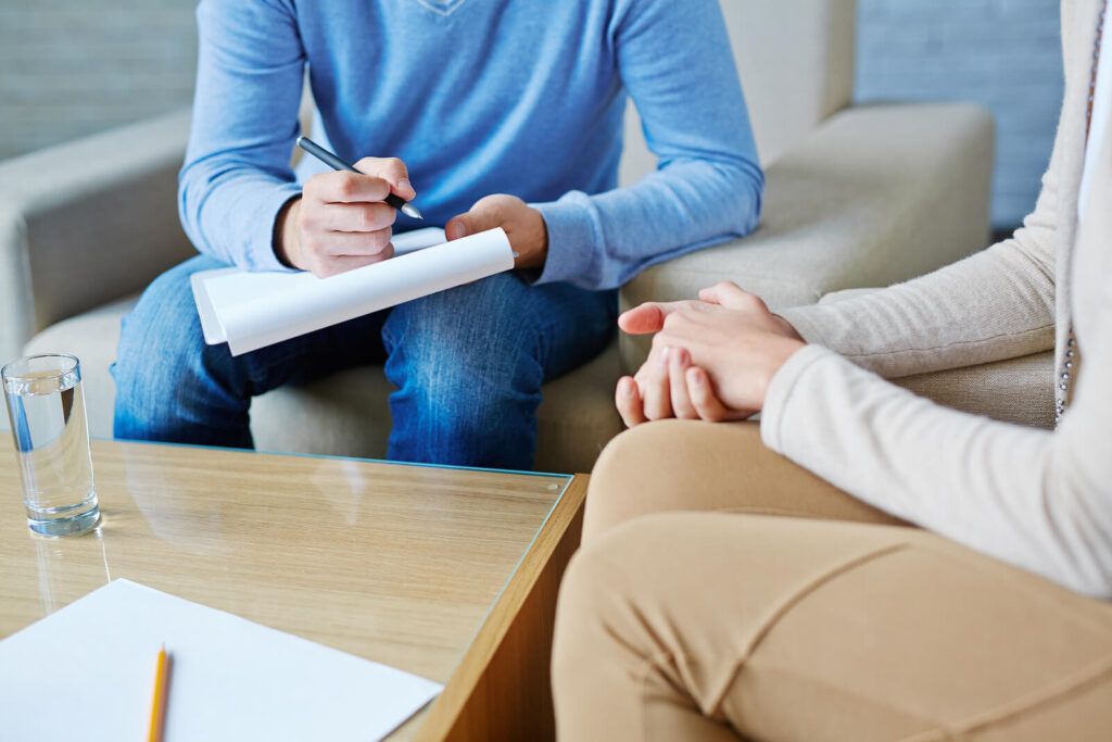 A close up of a person taking notes on a clipboard while sitting across from a person. Learn more about the support that depression treatment in Powhatan, VA can offer by contacting an equine therapist in Virginia. 