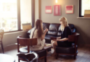 A client and EMDR therapist in Richmond, VA meeting in a comfortable therapy office. EMDR in Powhatan, VA and EMDR intensives in Richmond, VA offer safe spaces where clients can process trauma and find healing with the guidance of a skilled EMDR therapist. 