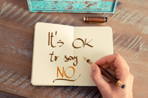 Open journal with the words ‘It’s OK to say NO,’ illustrating boundary-setting and self-care skills often explored in depression treatment in goochland, va, with an online depression therapist in goochland, va, or with an online therapist in powhatan, va. 