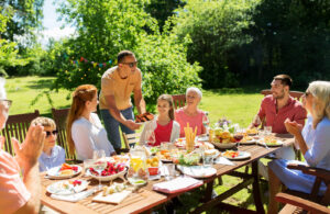 Family gathered for an outdoor meal, reflecting the renewed connection clients build through life transitions therapy in Virginia, life transitions therapy in Lynchburg, VA, and intensive EMDR therapy in Powhatan, VA. 