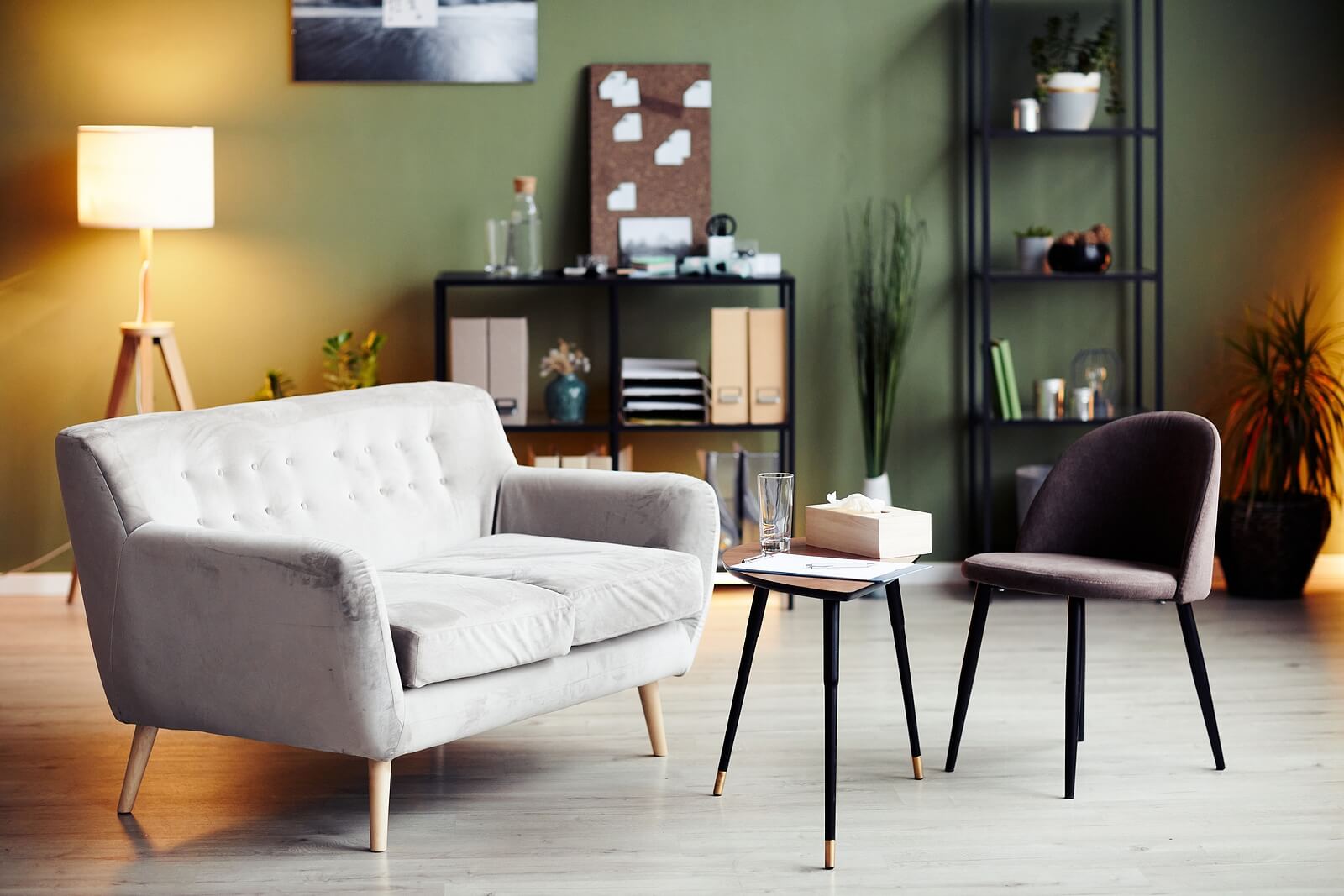 A cozy, softly lit therapy office with a couch, chair, and side table, the kind of unhurried space used for EMDR intensives in Richmond, VA. An EMDR therapist in Richmond, VA might spend a full day here, one of many settings offering EMDR intensives in Virginia.